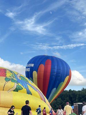 The single inflated balloon, and the half inflated one.