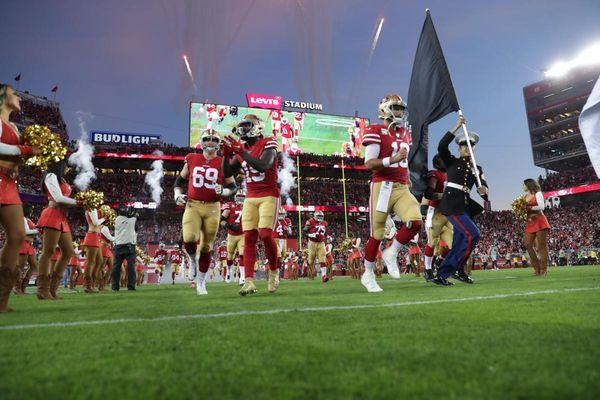 Staff Sergeant Lawas participating in the flag ceremony for the 49ers ca Seahawks MNF game on Veteran's day.