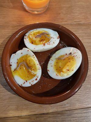 Soft boiled eggs with anchovies