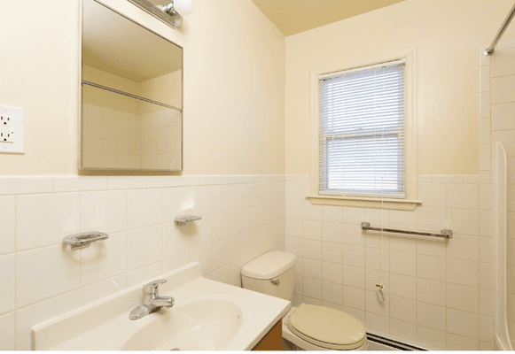 Tiled bathrooms have a clean and neat appearance.