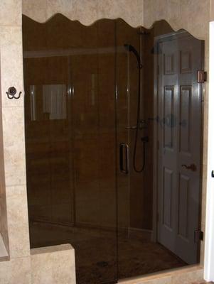 Frameless Shower Door with Mountain Top Bronze Glass