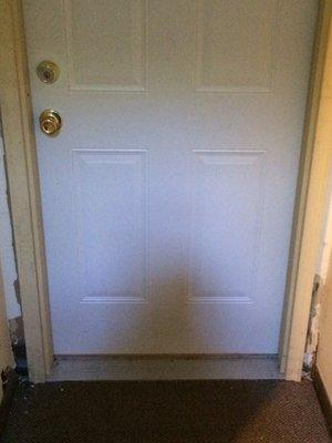 A new front door install with holes in sheet rock that weren't previously there.