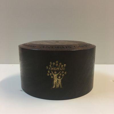 Gold filled company logo on walnut award base