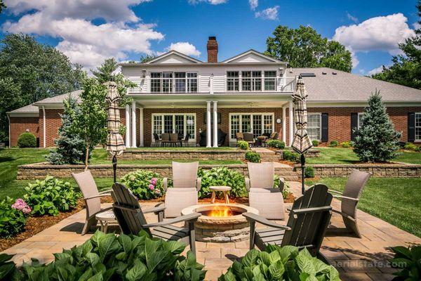 Residential exterior real estate photography with comfortable firepit patio nestled directly off golf course.