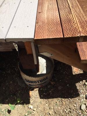 The cans (instead of posts) and the underside of the deck still show...