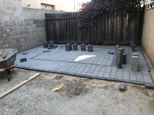 Paver patio install with a rectangular insert