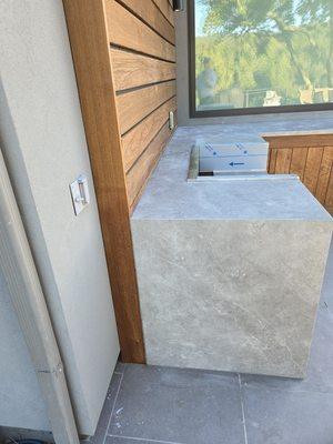 Porcelain slab with waterfall drop edge