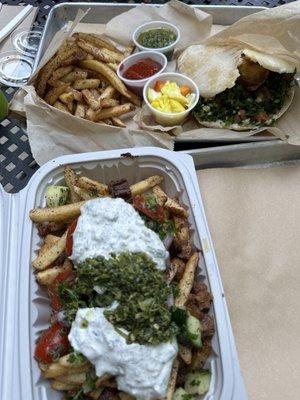 GRILLED STEAK SHAWARMA ON SUMAC FRIES W/ LABNEH, ISRAELI SALAD & ZHUG