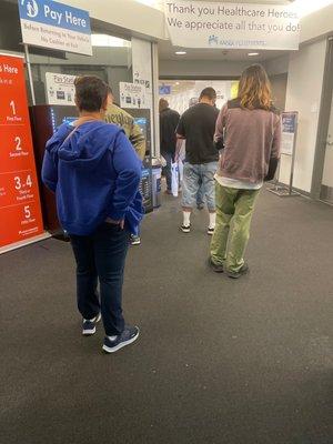 The line for the pharmacy, out the building and into the parking garage. And no social distancing, since the line is outside now?