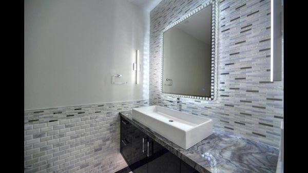 Powder bath installed with mesh surround and vanity wall