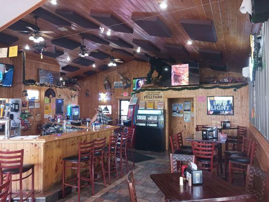 Bar, high tops, low tables, bathroom entrance