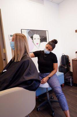 Vanessa giving a precision haircut