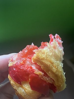 last bite of a delicious strawberry croissant at patis amsterdam