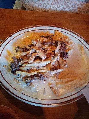 Chicken and beef over rice and French fries