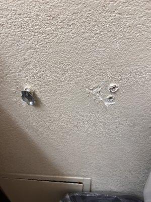 Toilet paper holder ripped off the wall.