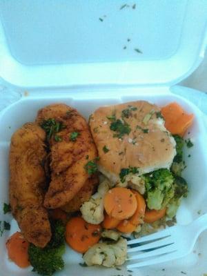 Fried chicken tenders with mixed veggies and a biscuit.