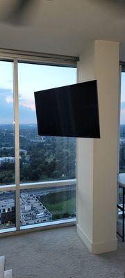 Uptown living requires Uptown Taste! 55" QLED with full motion wall mount. Installed on concrete column.