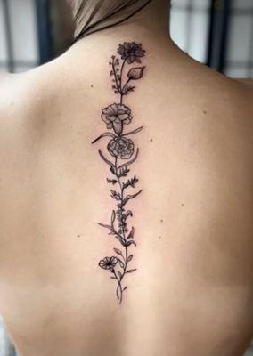 Beautiful back tattoo by Andrea