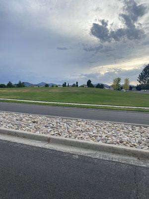 Mostly just a HUGE field but it does have a small picnic area and playground. The hill would be fun to sled down (away from the road).