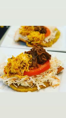 Tostones with chicken and pork.