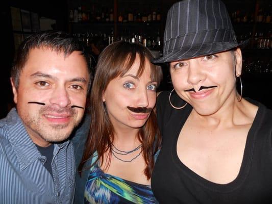 Nathan Maltos, Julia Rae and Julie Giles from Swagger get ready to work Yelp's Mustache Bash!