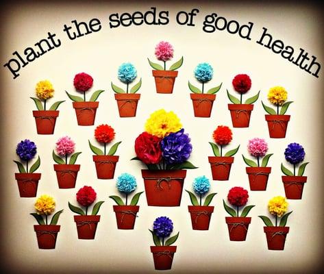 "Planting the Seeds of Good Health" wall of patient testimonials on our "nurturing pots". -Spring 2012