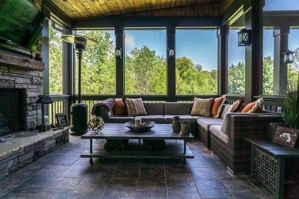 Tile screen porch with pvc wrapped columns and fireplace.