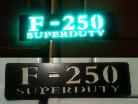 F250 sign before and after light added.