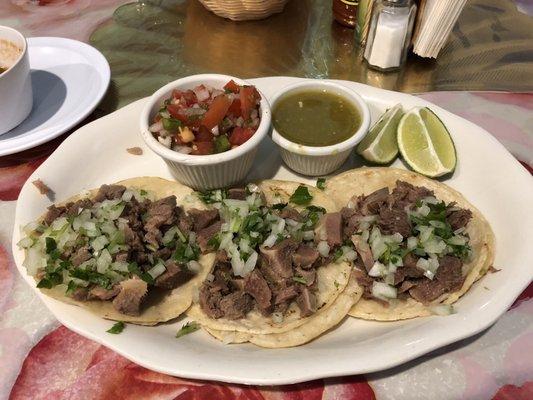 Beef tongue tacos, tender as can be with fresh toppings.