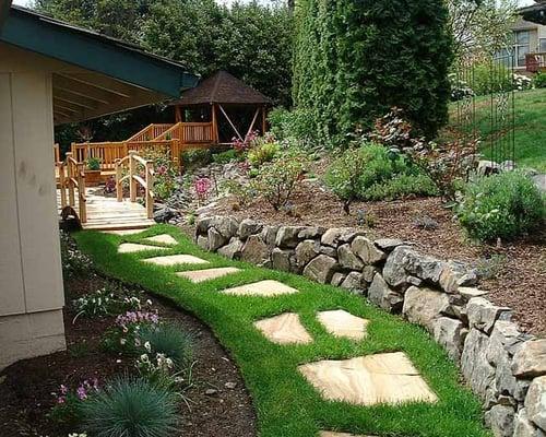 We can add a path (and a rockery!) to guide your guests around your house.