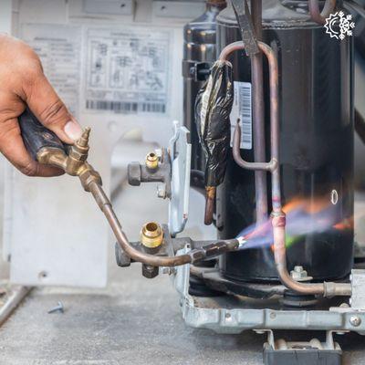 soldering air conditioning lines during a air conditioning repair service call