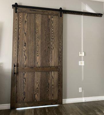 Our beautiful red oak door with charcoal finish, 70/30 design and black hardware.