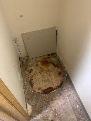 The hole that they cut in the wall and threw a board in front of.