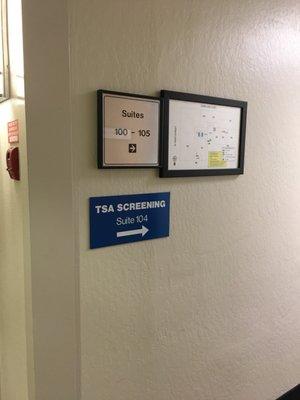 TSA Screening to your right -- first door on your left. FYIFWIWLOLWTFBBQ, cell phone usage is prohibited from within the screening office.