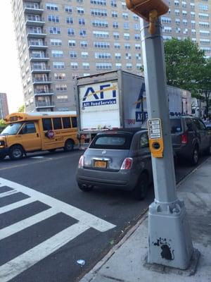 Great place to park your truck, blocking the only lane for the street right after a major commuter bus stop. Accident scenario!