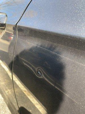 Rear driver's side door dent