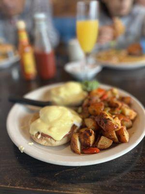 Eggs Benedict and a mimosa