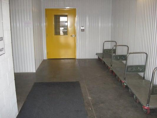 Several clean and spacious access points with carts and dolleys