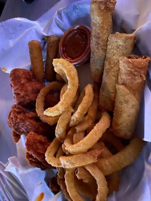 Sampler platter: mozzarella sticks, chicken fingers, onion rings, and pizza logs