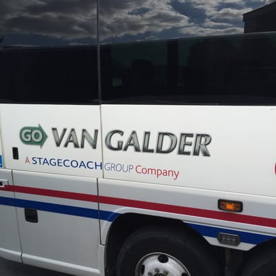 Name on the side of the bus. They will all read Coach USA but other buses obviously go elsewhere.