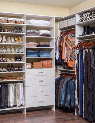 Beautiful white His & Hers closet design in Northport, AL