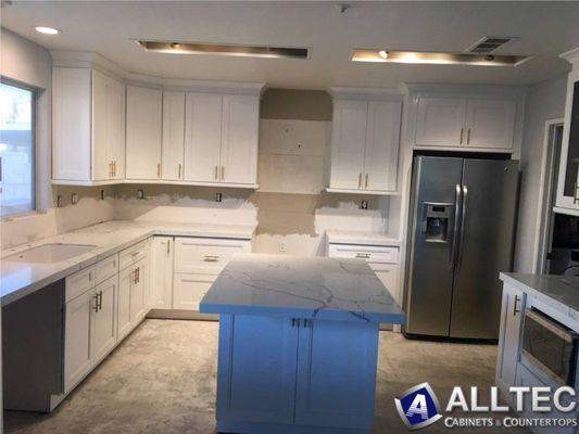 White Double Shaker Cabinets with Calacatta Cielo Quartz