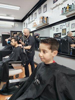 My handsome son after a haircut by Steve.