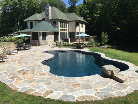 Flag stone pool deck, diving stone, house veneer, and chimney