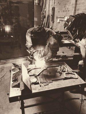 Makers learning to Weld in our Fabrication Shop