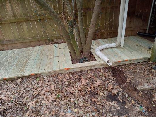 Finish deck walkway around a tree and drain