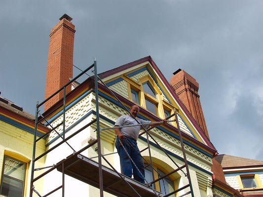 Gene Padgitt taking down scaffold after building 5 historic chimneys