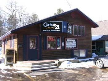 CENTURY 21 Pierce Realty, located next to the post office.