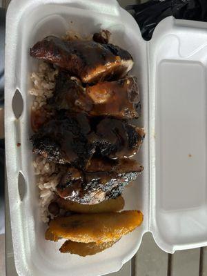 Jerk chicken, rice and peas, and plantains. Yummm