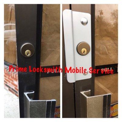 Commercial Latch Protector installed on an aluminum store front door in Randolph MA to protect against and deter break ins